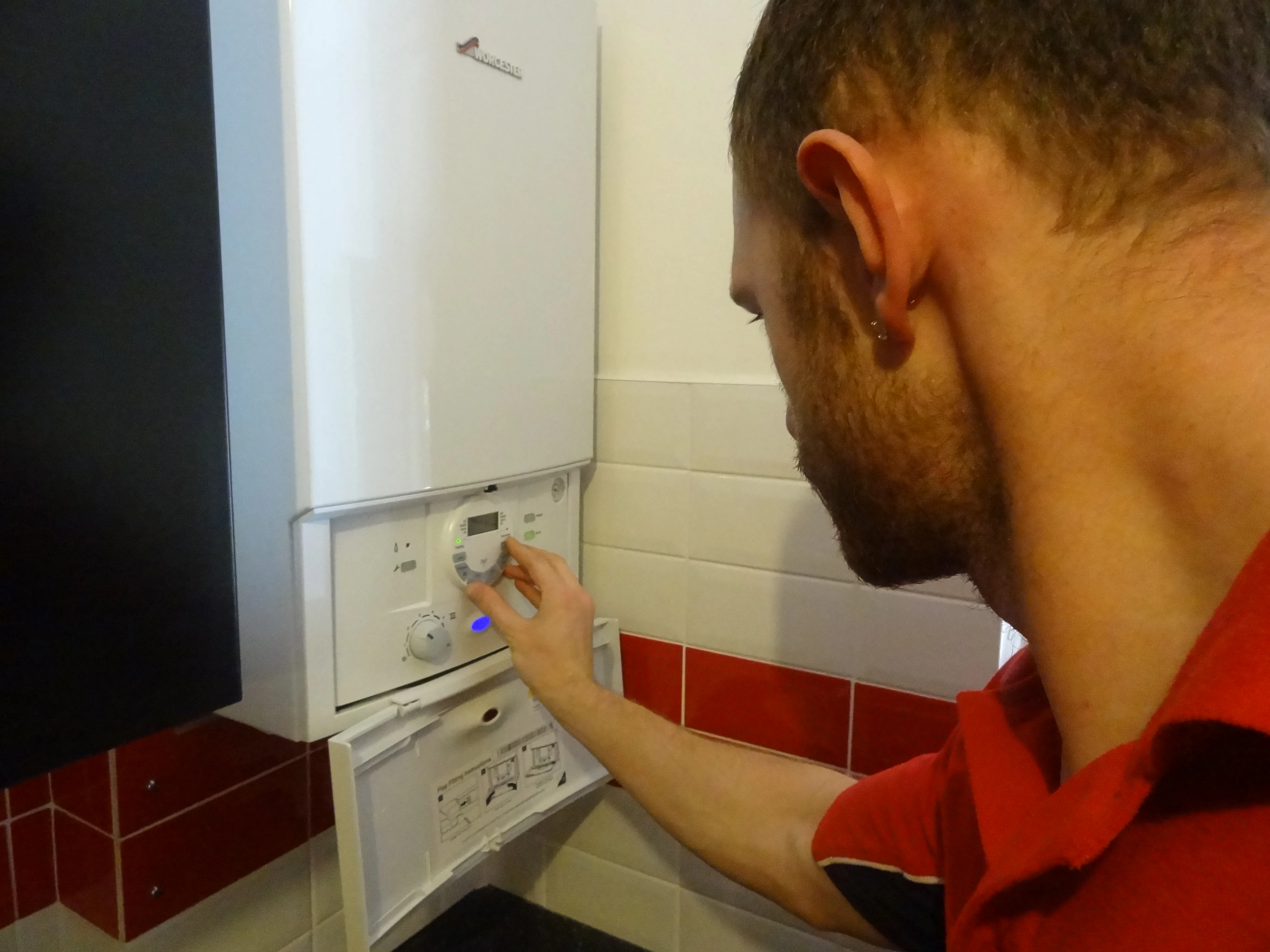 Pinner Plumbers 247 engineer working on a boiler installation in Pinner